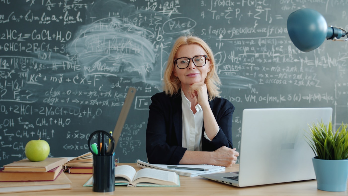Teacher at her desk with a laptop